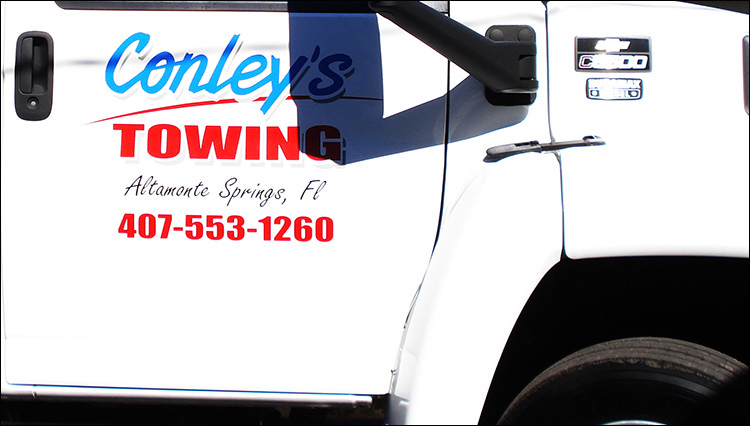 Conley's towing custom truck door lettering